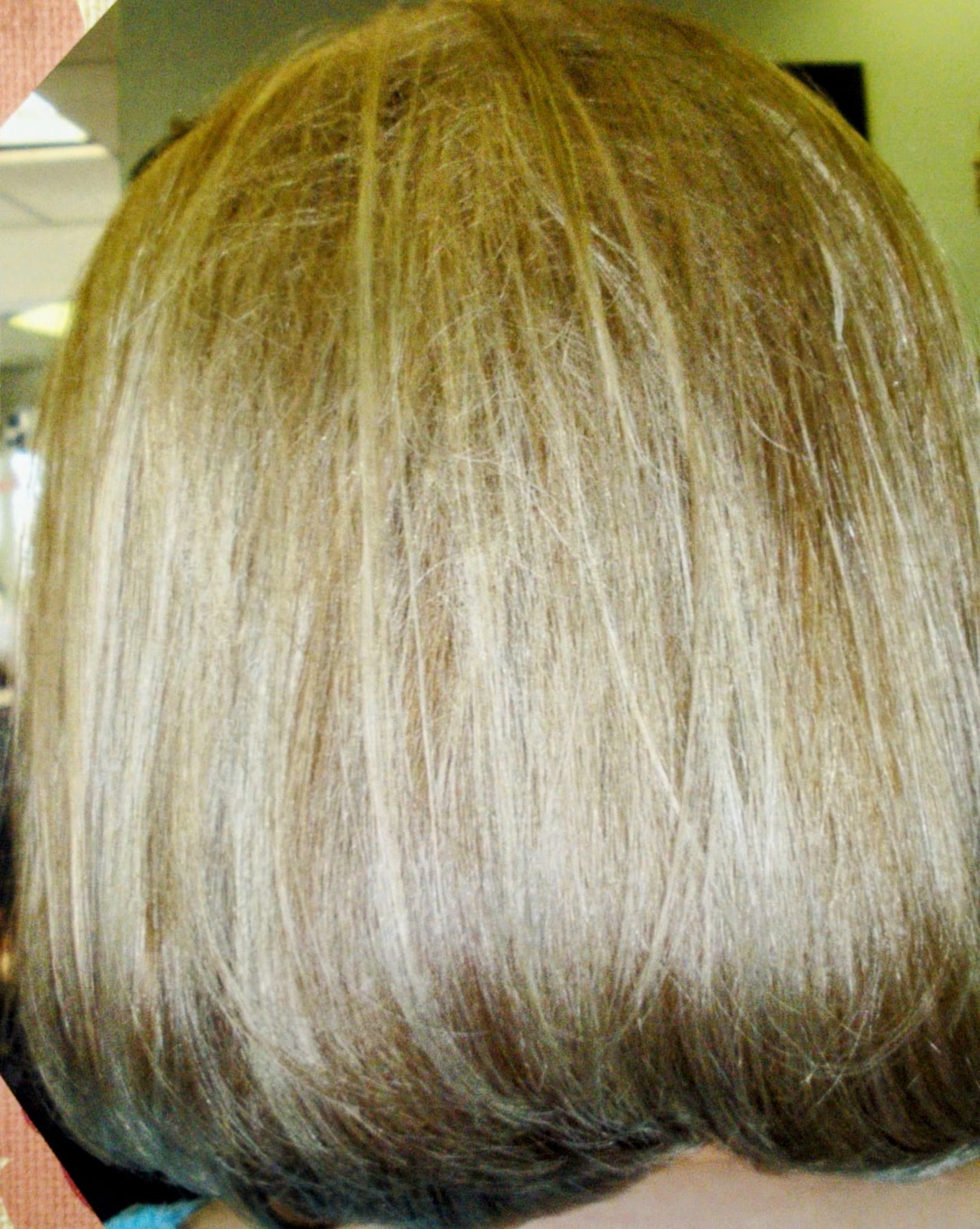 Straight blonde bob with a smooth, rounded finish