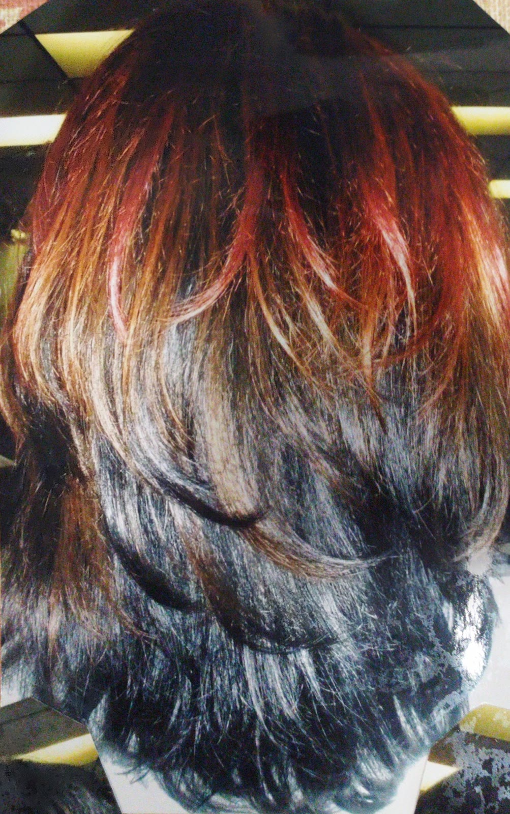 Two-tone layered cut with red on top blending into black underneath
